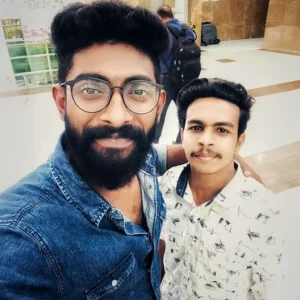 Adhil Noushad with Malayalam actor Pareekutty at a function, best graphic designer in Kerala