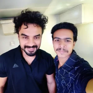 Adhil Noushad with Malayalam actor Tovino Thomas during an event, best graphic designer in Kerala