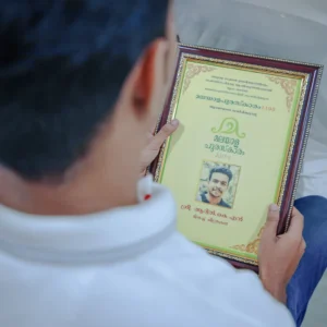 Malayala Puraskaram award certificate (Prashasthi Pathram) received by Adhil Noushad, recognized as the best graphic designer in Kerala