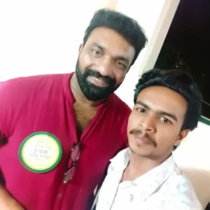 Adhil Noushad with Malayalam actor Kottayam Nazeer during a cultural event, best graphic designer in Kerala