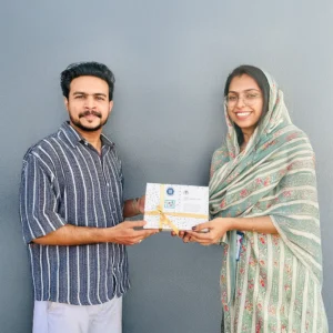 Adhil Noushad receiving Best Community Member award for active participation in LinkedIn Malayalees community, recognized as the best graphic designer in Kerala