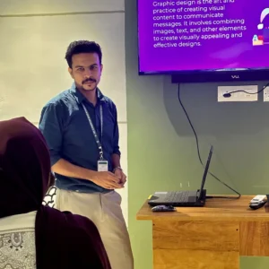 Adhil Noushad taking a multimedia class for students, recognized as best graphic designer in Kerala and design tutor