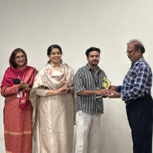 Adhil Noushad receiving memento as judge during workshop at KMEA Engineering College, best graphic designer in Kerala