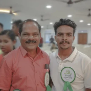 Adhil Noushad with Malayalam actor P. P. Kunhikrishnan at an event, best graphic designer in Kerala