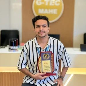 Adhil Noushad receiving Best Employee Award from G-TEC Education, recognized as the best graphic designer in Kerala