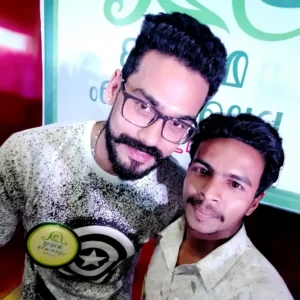 Adhil Noushad with Malayalam actor Varun krishna during an event, best graphic designer in Kerala
